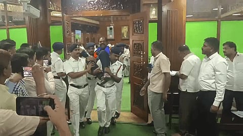 BJP MLAs being removed from the house by Marshals.