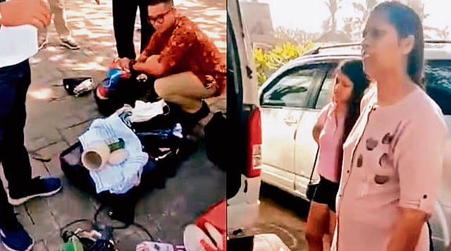 Stolen moments: An Indian family caught and stopped from leaving the hotel staff in Bali for stealing accessories. 