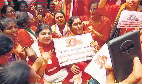 Mahila Congress activists stage a protest in front of the BJP state headquarters at Nampally, demnding implemention of 33% women’s quota