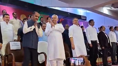 Bihar Chief Minister Nitish Kumar seen speaking and greeting other members at an event in Patna 