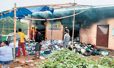 Damaged books and stationery items were strewn outside the burnt godown.
