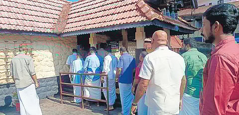 A group of devotees, led by SNDP joint committee, proceeding for darshan at the Kakkattu Koikkal Sree Dharma Sastha temple wearing shirts 