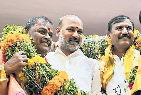Minister of State for Home Affairs Bandi Sanjay Kumar (L) takes part in felicitation ceremony for MLCs in Karimnagar  on Sunday