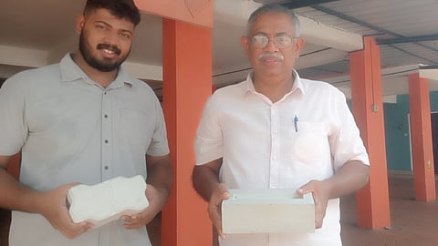 John Thomas and Thomas John V with blocks made of alkali-activated concrete