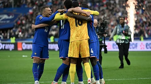 France's forward #10 Kylian Mbappe (L) celebrates France's victory with teammates at the end of the UEFA Nations League quarter-final second-leg football match between France and Croatia 