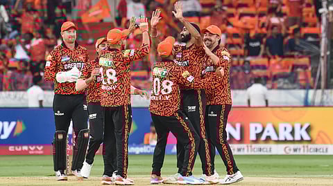 Sunrisers Hyderabad players celebrate the wicket of Rajasthan Royals batter Riyan Parag during the IPL 2025 match between Sunrisers Hyderabad and Rajasthan Royals at Rajiv Gandhi International Cricket Stadium, in Hyderabad.
