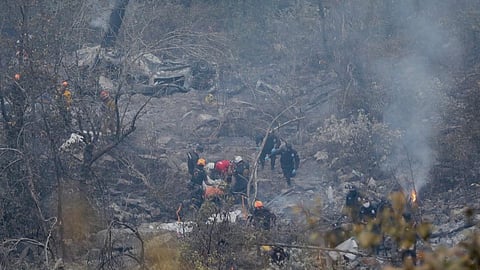 The vehicle's fall caused a forest fire that was later extinguished, according to the Civil Protection Department.