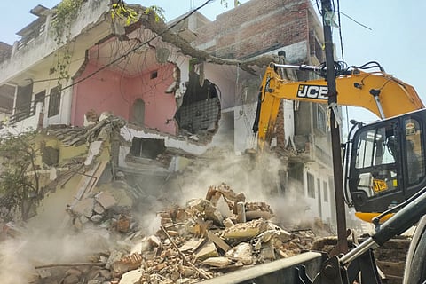 FILE | The house of Fahim Khan, alleged mastermind behind the Nagpur riots, being demolished, after he failed to remove an illegal structure within a 24-hour deadline, in Nagpur, Monday, March 24, 2025. 