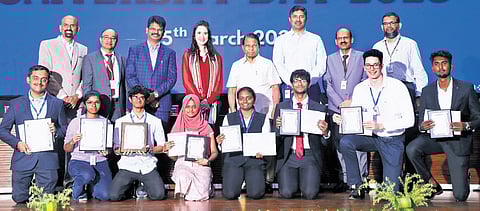G Viswanathan, founder & chancellor, and GV Selvam, vice president, along with students who won prizes at the university day celebrations at VIT