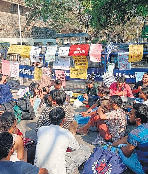 Student and faculty organisations protesting outside Ambedkar University 
