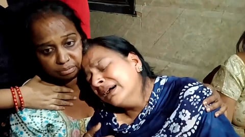 Family members mourn after a 9th class student was kidnapped and murdered by friends for Rs 10 lakh ransom, in New Delhi.