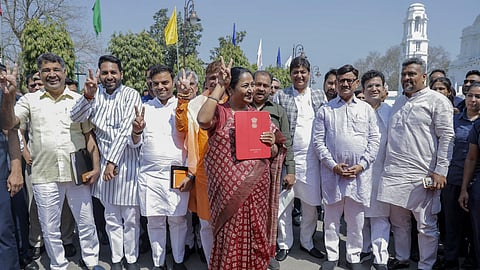 Delhi Chief Minister Rekha Gupta arrives to present the Budget 2025-26 in the Assembly, in New Delhi, Tuesday.
