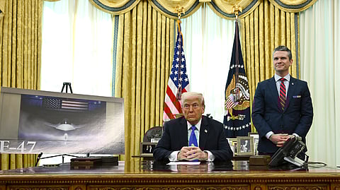 US President Donald Trump, left, and Secretary of Defense Pete Hegseth listen during an event in the Oval Office of the White House in Washington, Friday, March 21, 2025.