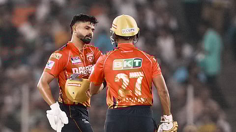 Punjab Kings' batters Shreyas Iyer and Shashank Singh walk off the field at the end of Punjab's innings.