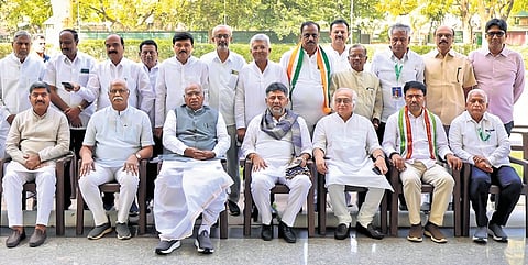 AICC president Mallikarjun Kharge, DCM and KPCC president DK Shivakumar and Rajya Sabha member Jairam Ramesh with District Congress Committee presidents from Karnataka, in New Delhi on Friday