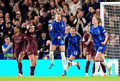 Chelsea's Nathalie Bjoern, front center, celebrates scoring her side's second goal during the Women's Champions League, quarter-final second leg, soccer match between FC Chelsea and Manchester City in London, England, Thursday, March 27, 2025. 