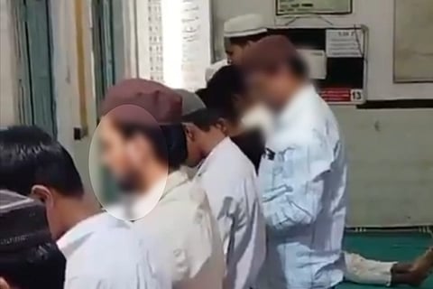 A screengrab from the video of the businessman offering namaz