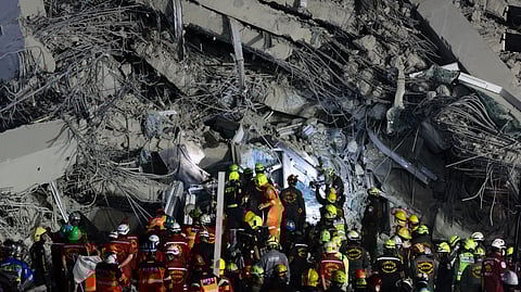 Rescuers work at the site of a high-rise building under construction that collapsed after a 7.7 magnitude earthquake in Bangkok, Thailand, early Saturday, March 29, 2025.