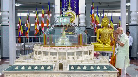 In this image released by PIB, Prime Minister Narendra Modi pays tribute at the Deekshabhoomi, Nagpur on Sunday.