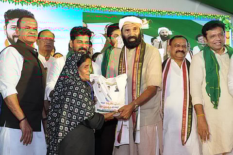 CM Revanth Reddy distributed packets of fine rice to ten beneficiaries at the public meeting held in Huzurnagar