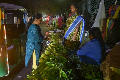 People' purchasing pooja material ahead of Ugadi festival in Vijayawada on Saturday.