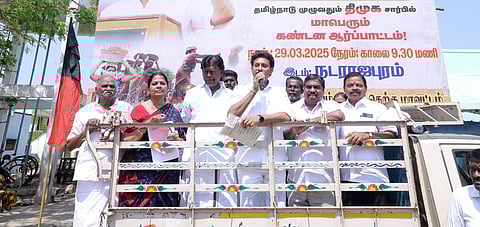  DMK cadres led by Minister Anbil Mahesh stage protest against Union Government not releasing fund for Mahatma Gandhi NREGA scheme in Tiruchy on Saturday 