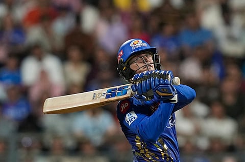 Mumbai Indians' Ryan Rickelton plays a shot during the Indian Premier League match against Kolkata Knight Riders at Wankhede Stadium in Mumbai (Photo | AP)