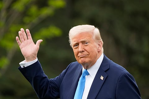 President Donald Trump walks from the Oval Office to board Marine One on the South Lawn of the White House en route to Florida.