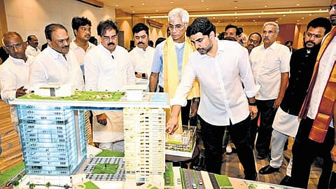HRD and IT Minister Nara Lokesh observing the model of the Varun Bay Sands project in Visakhapatnam.