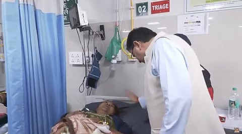 Chief Minister Pushkar Singh Dhami inquiring about the condition of patients affected by food poisoning due to the consumption of buckwheat flour in the hospital.