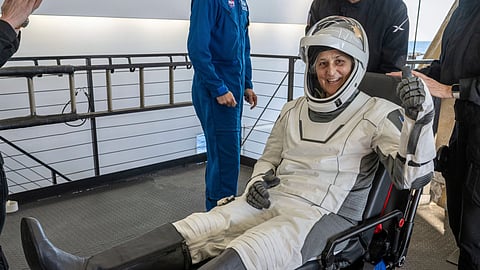NASA astronaut Suni Williams gives a thumbs-up after being helped out of a SpaceX capsule onboard the SpaceX recovery ship Megan after landing in the water off the coast of Tallahassee.