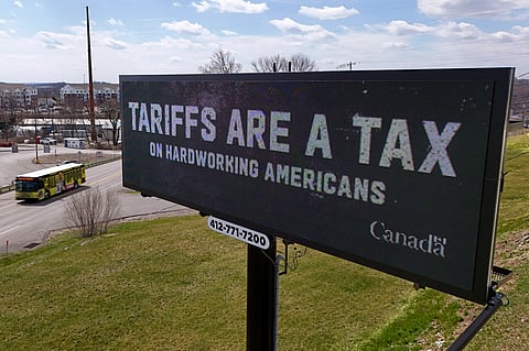 A digital bill board flashes a tariffs message in Kennedy Township.