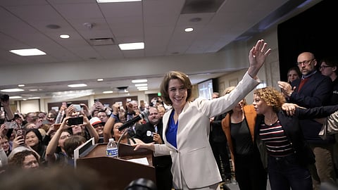 Wisconsin Supreme Court candidate Susan Crawford waves during her election night party after winning the election Tuesday.