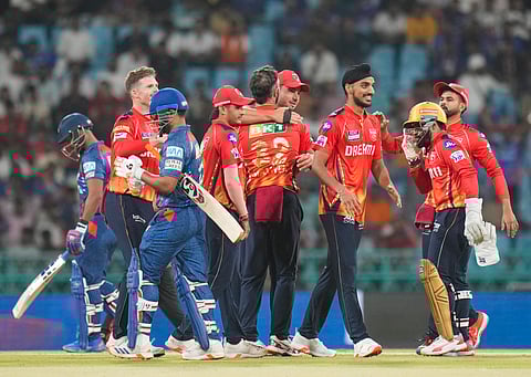 Punjab Kings' Glenn Maxwell with teammates celebrates the wicket of LSGs' Rishabh Pant during an IPL 2025 cricket match between LSG and Punjab Kings, in Lucknow, Tuesday, April 1, 2025.