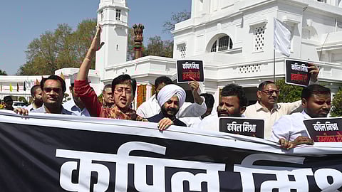Leader of Opposition in the Delhi Assembly Atishi with AAP MLAs stages a protest demanding the resignation of Delhi Law and Justice Minister Kapil Mishra, during the Budget session of the Assembly, in New Delhi on Wednesday.