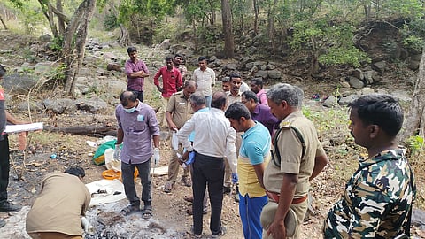 Officials investigating in the reserve forest where the murder took place.