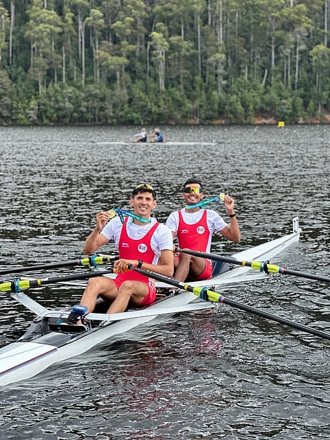 Services' rowers Ajay Tyagi (L) and Ujjwal Kumar Singh with their gold medals