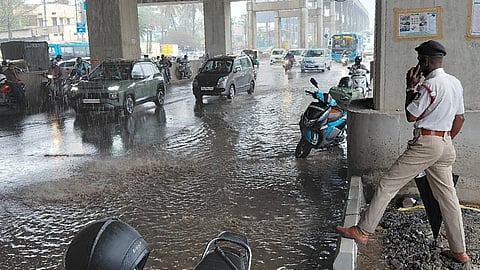 A police officer watches the traffic movement at Ecospace towards Marathahalliroad.