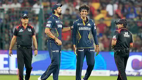 Gujarat Titans' Sai Kishore, second right, and teammate Ishant Sharma celebrate the dismissal of RCB's Krunal Pandya during the IPL cricket match between Gujarat Titans and RCB at Chinnaswamy Stadium in Bengaluru, India, Wednesday, April 2, 2025.