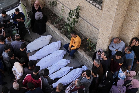 Palestinians grieve over the bodies of their relatives, who were killed in an Israeli airstrike, at the Baptist Hospital in Gaza City, on Thursday, April 3, 2025.