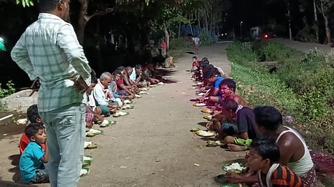 Villagers attending a grand feast as part of the celebration.