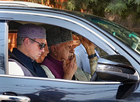 Jammu and Kashmir Chief Minister Omar Abdullah and National Conference President Farooq Abdullah arrive for a meeting, in Srinagar, Friday, April 4, 2025