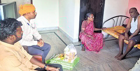 Members of Seva Bharathi organisation hand over groceries and medicines to Jampala Gopal and his mother on Friday