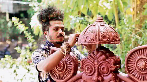 Sagar Naik Mule working on a clay sculpture