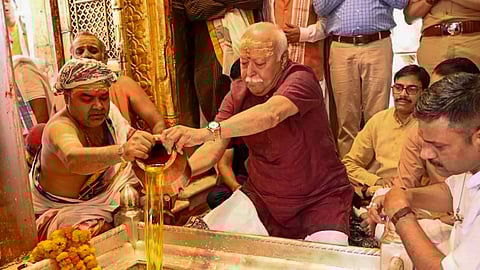 RSS chief Mohan Bhagwat offers prayers at the Kashi Vishwanath Temple, in Varanasi, Saturday, April 5, 2025.