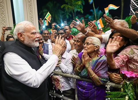 In this image released by PMO on Friday, April 4, 2025, Prime Minister Narendra Modi being greeted by members of the Indian community upon his arrival in Colombo, Sri Lanka. 