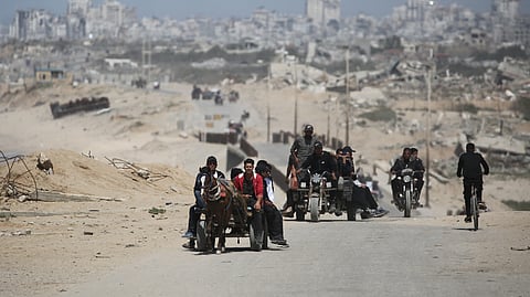 Palestinians ride vehicles along the coastal al-Rashid road, linking Gaza City in the north and Nusseirat in the central part of the Palestinian territory on April 4, 2025. Israel announced the launch of a new ground offensive in Gaza City on April 4, with rescuers saying military operations had killed at least 30 people across the Palestinian territory since dawn.