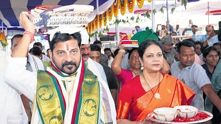 Chief Minister A Revanth Reddy, along with his wife, carries ‘pattu vastralu’ during Sita Rama Kalyanam at Bhadrachalam on Sunday.