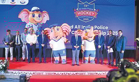 Odisha DGP YB Khurania and others pose along with mascot ‘ASHA’ after its launch during a curtain-raiser ceremony of the All India Police Hockey Championship-2025.