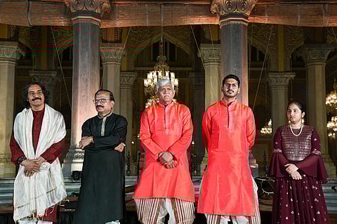 The main artists for the evening strike a pose ahead of their performances